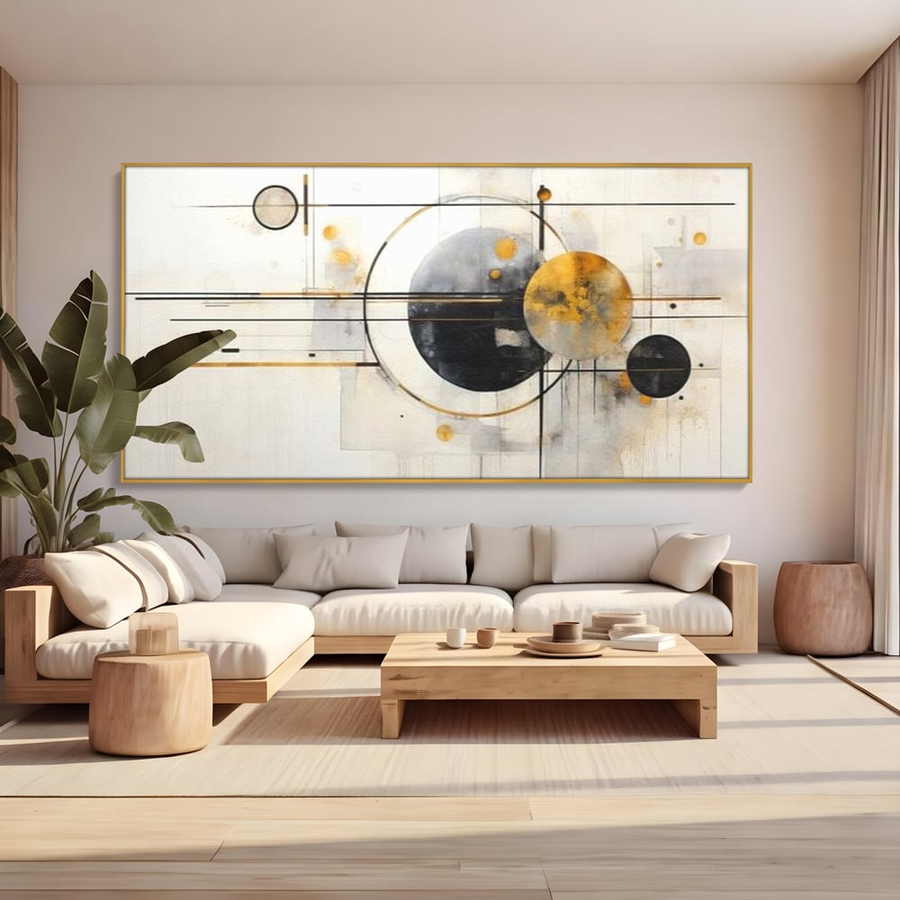 Tablou canvas cu pictura abstracta cu forme geometrice, in rama de aluminiu auriu, pe perete intr-un living